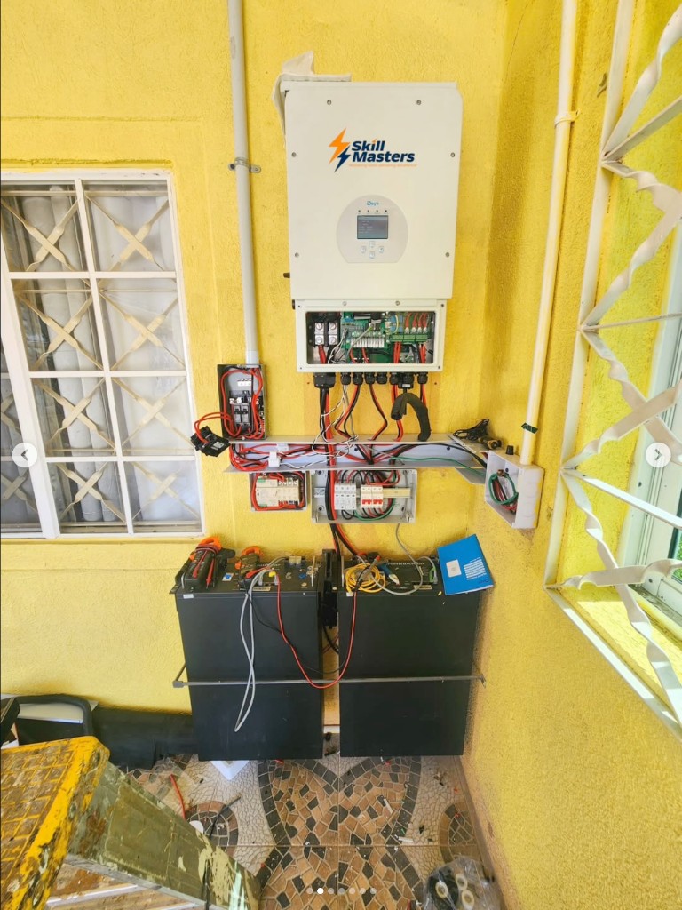 Solar install in progress with batteries and tools on site